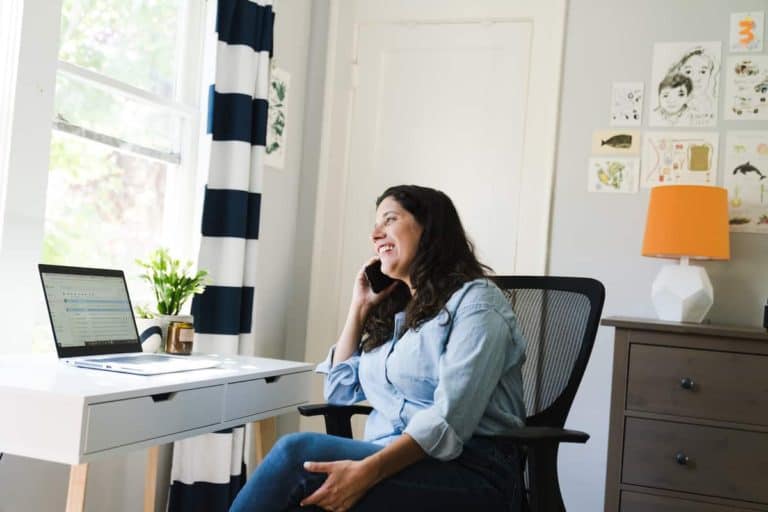 woman on phone in home office