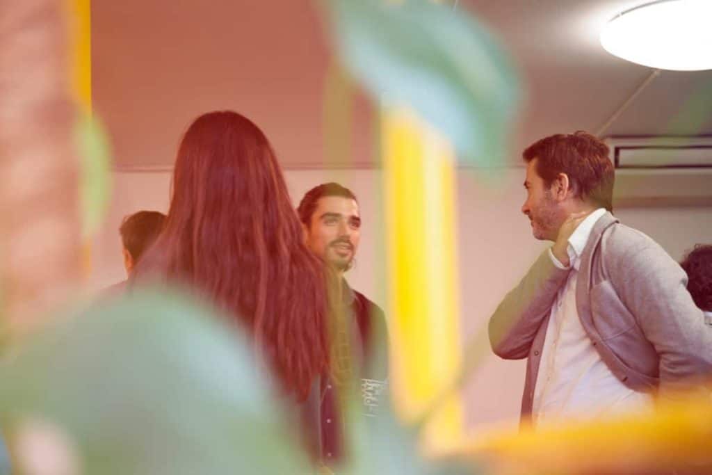 two men talking at a business networking event